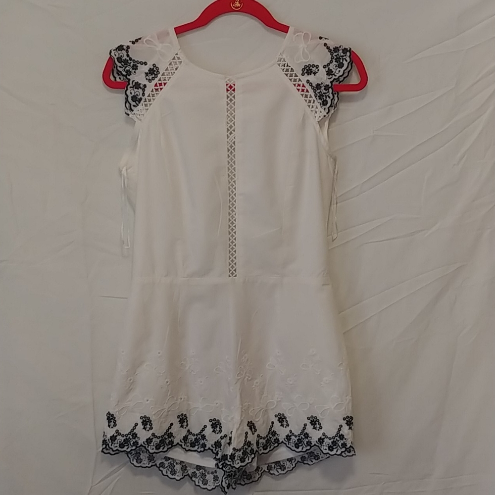 White romper with lace trim pattern